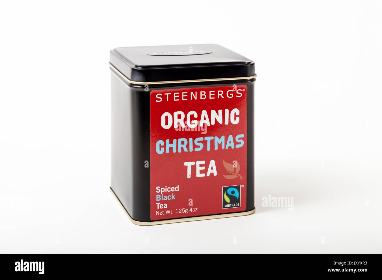 Fairtrade tea. A tea caddy of Steenberg's Organic Christmas Tea, a fairtrade product of spiced black tea. On a white background Stock Photo
