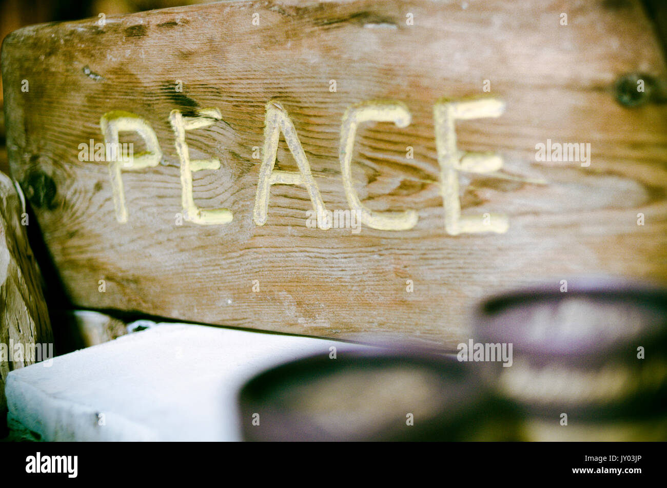 Peace sign on driftwood Stock Photo - Alamy