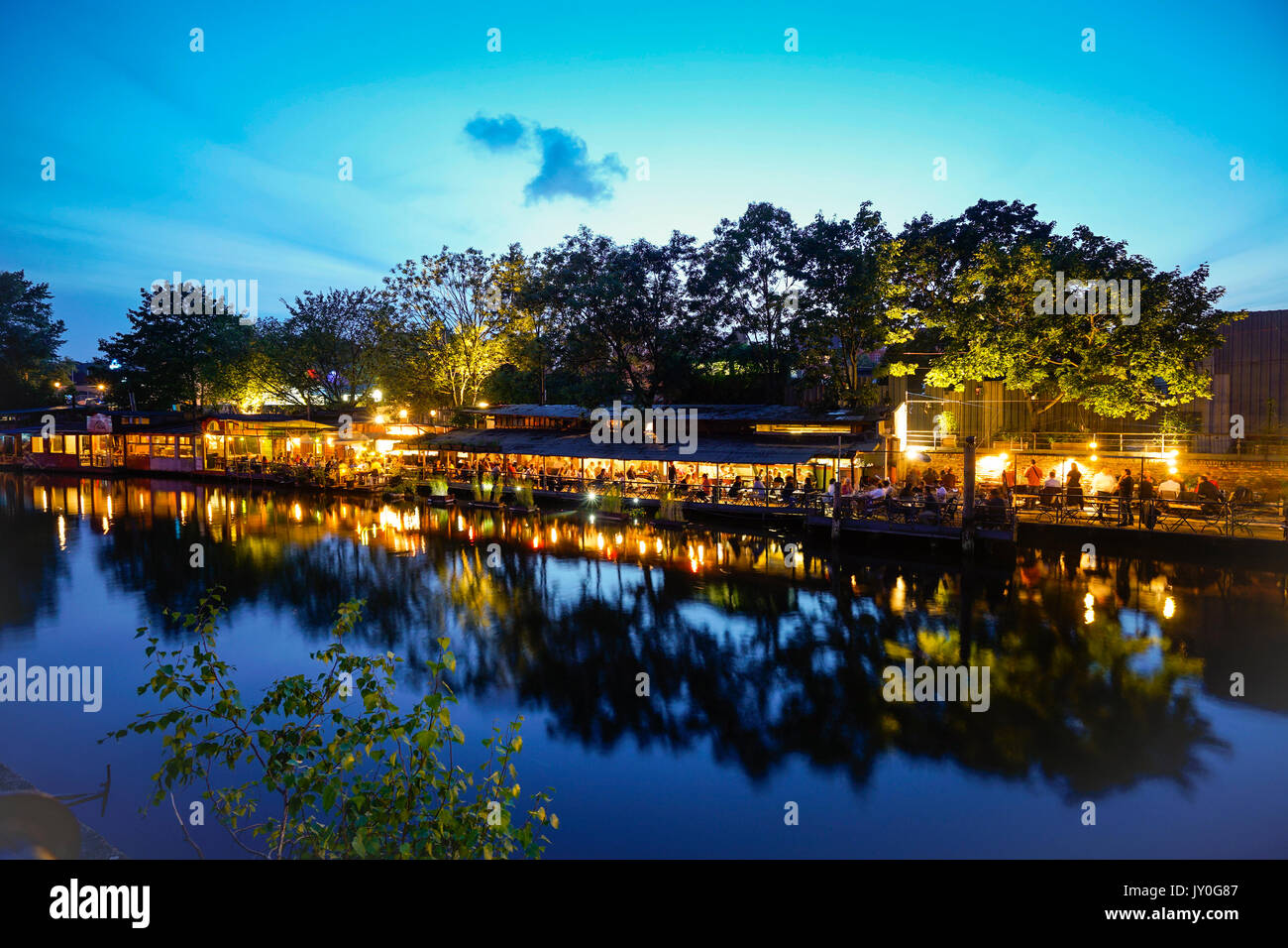 Freischwimmer cafe and bar beside canal in Kreuzberg , Berlin at night.Germany Stock Photo