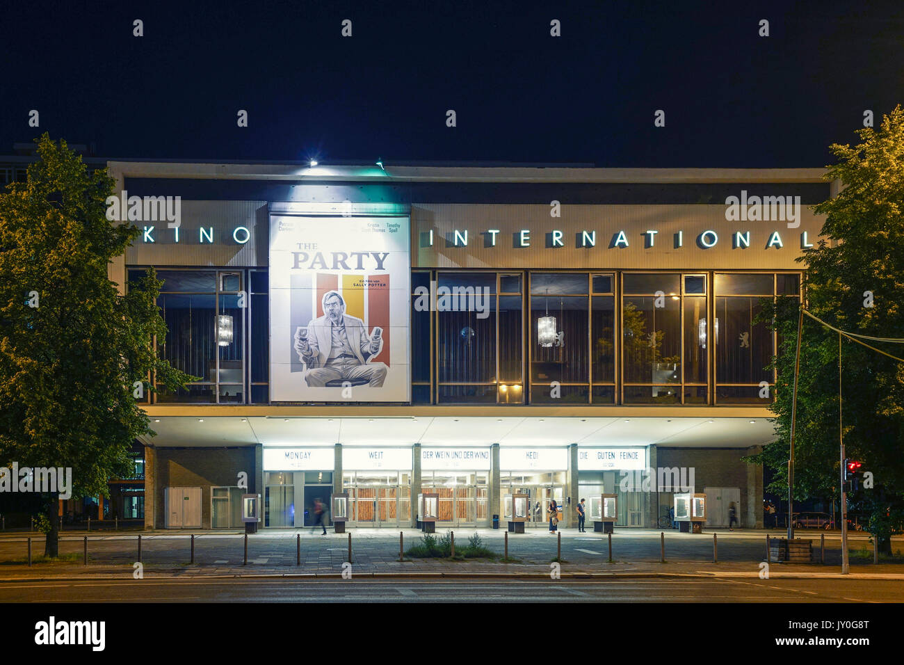 Night view of historic East German era Kino international on Karl Marx Strasse in Mitte Berlin, Germany Stock Photo