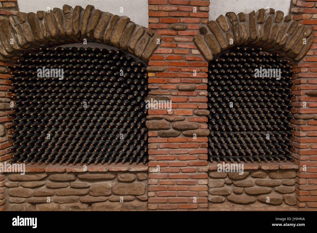 Stacked up wine bottles in the cellar,old wine cellars with bottles and