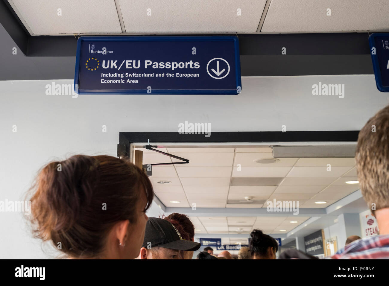 Passengers queing to go through passport control at Leeds Bradford airport, Yorkshire, England, UK Stock Photo