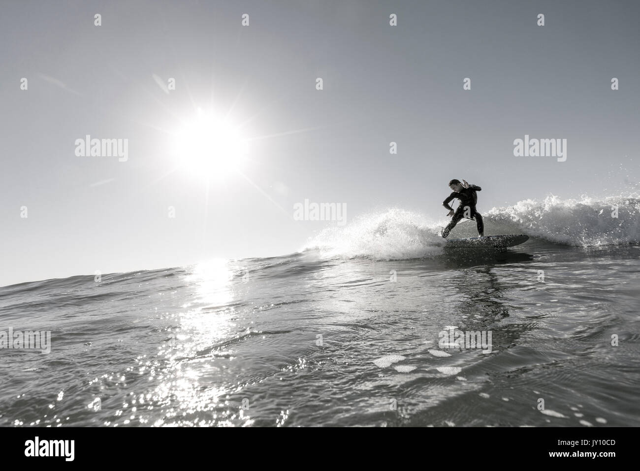 Black man surfing wave hi-res stock photography and images - Alamy