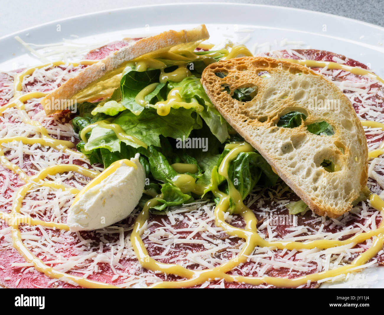 Beef carpaccio with truffle cheese Stock Photo Alamy