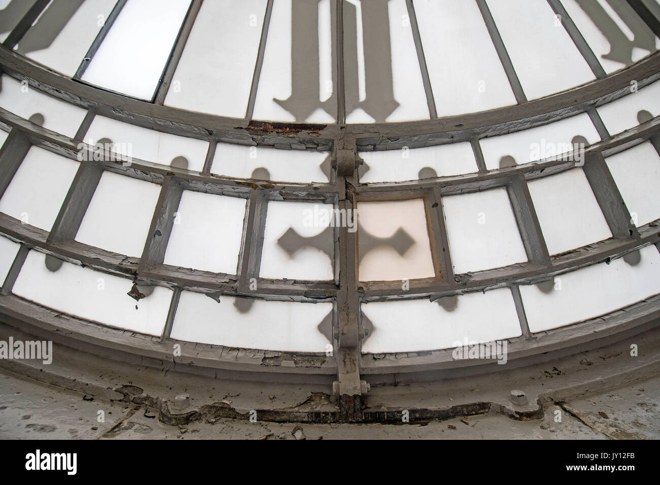 Crumbling paintwork on the interior of one of the four clock faces with the Elizabeth Tower ahead of the Big Ben bell ceasing to ring on Monday, at the Palace of Westminster, London. Stock Photo