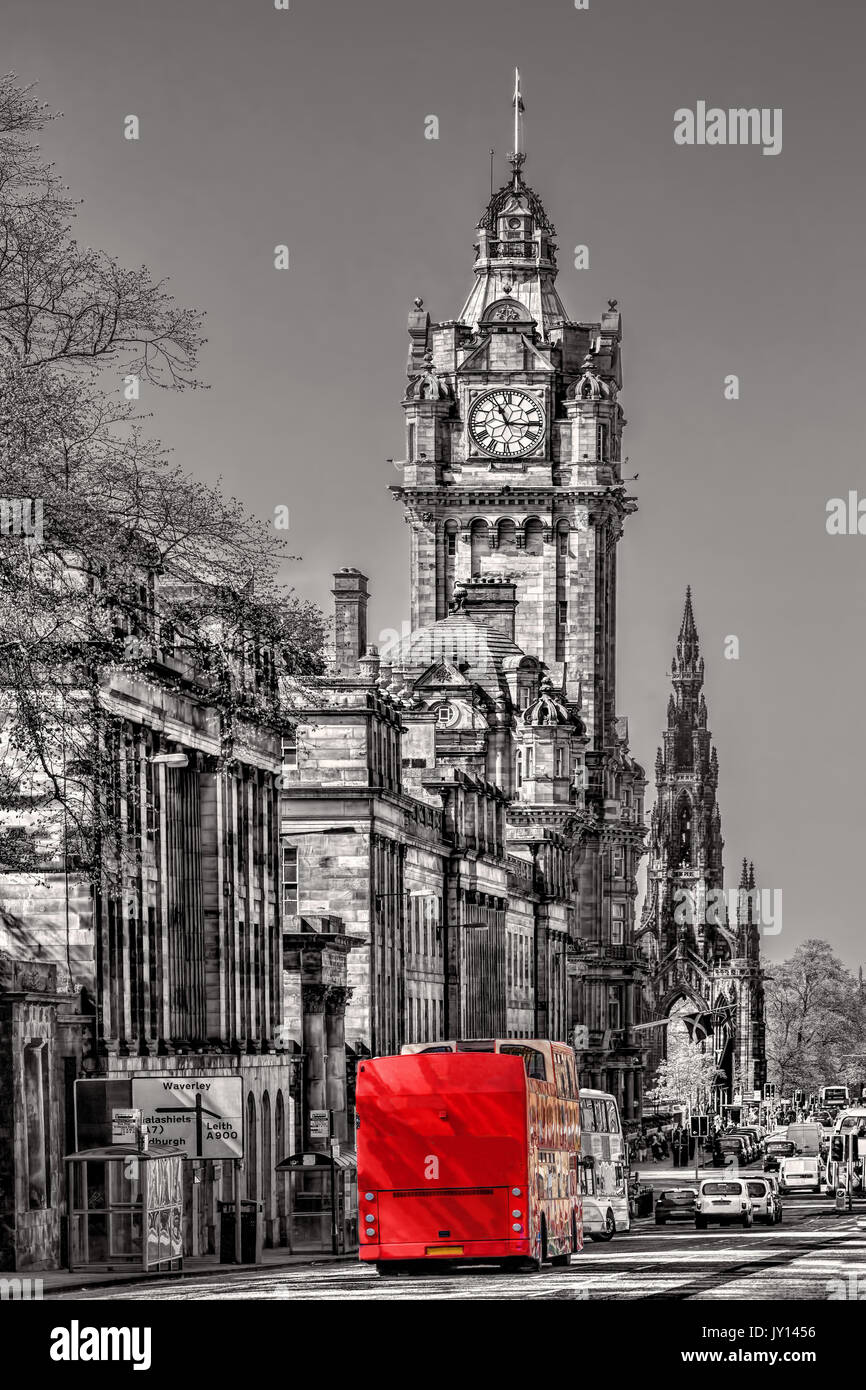 Edinburgh with red bus against clocktower in Scotland, UK Stock Photo