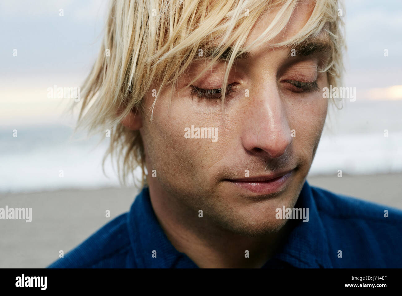Pensive man beach hi-res stock photography and images - Alamy