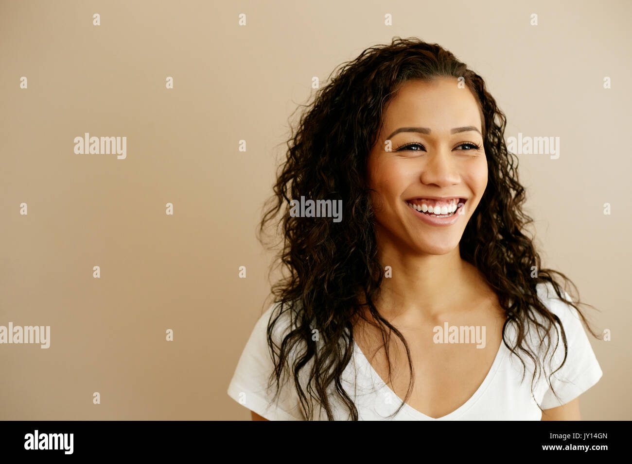 Portrait of smiling Mixed Race woman Stock Photo
