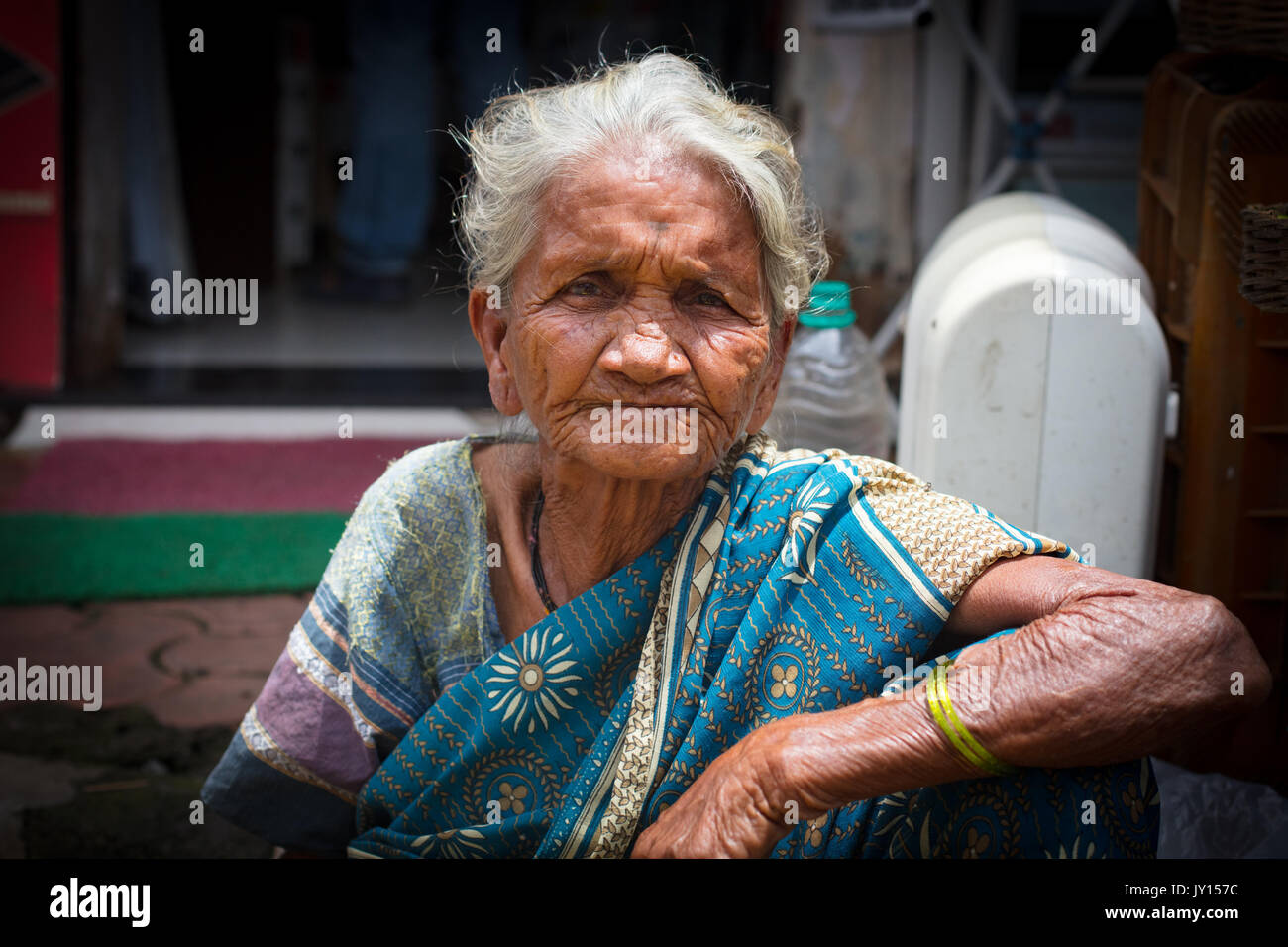 Mumbai, India - 5 August: An old woman sells lemons at Colaba Market in Mumbai, India Stock Photo