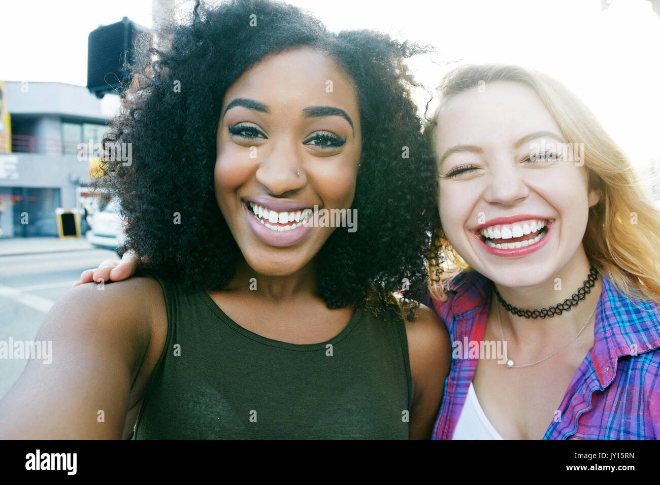 Friends posing for selfie in city Stock Photo