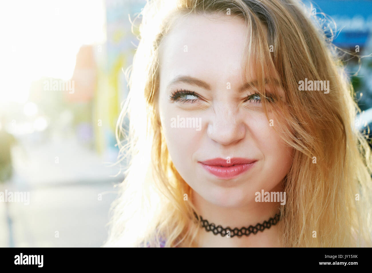 Portrait of Caucasian woman crinkling nose Stock Photo