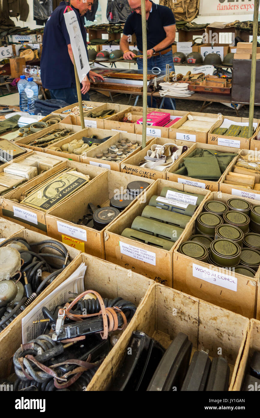 Vendor in WWII stand selling military memorabilia to World War Two collector at WW2 militaria fair Stock Photo