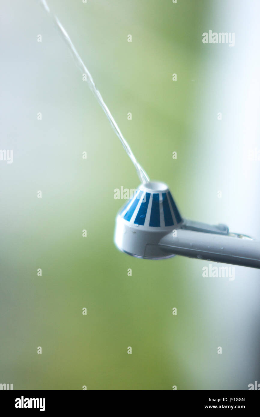 Dental water spray cleaner for interdental hygiene Stock Photo Alamy