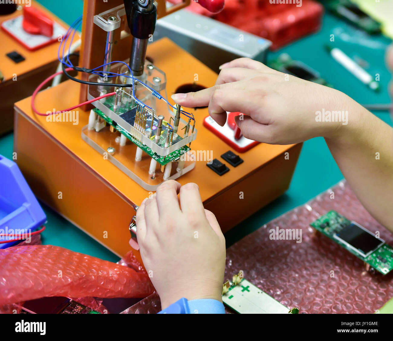 Simple industrial device for battery quality control Stock Photo Alamy