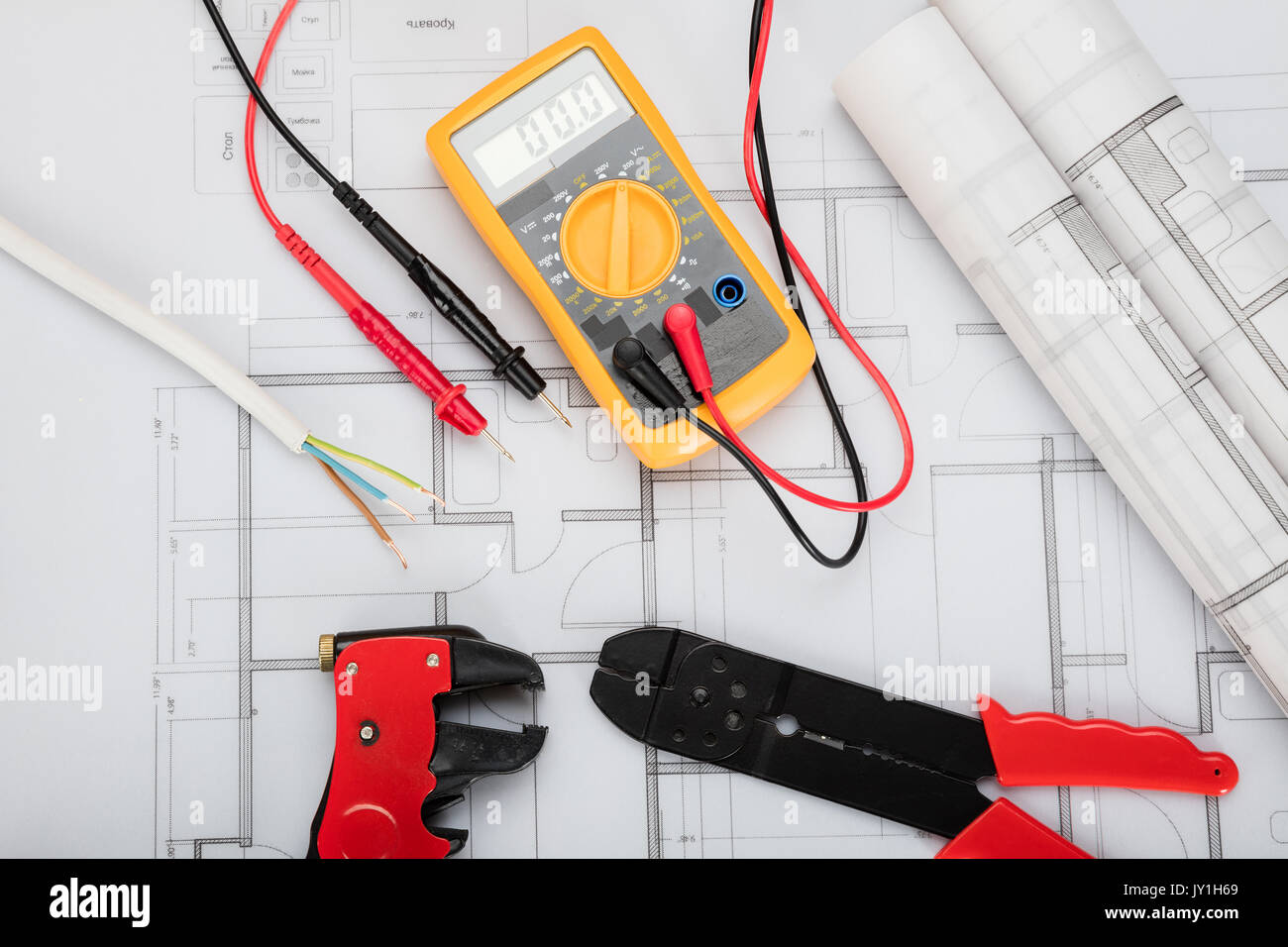 High Angle View Of Electrical Components Arranged On Plans Stock Photo
