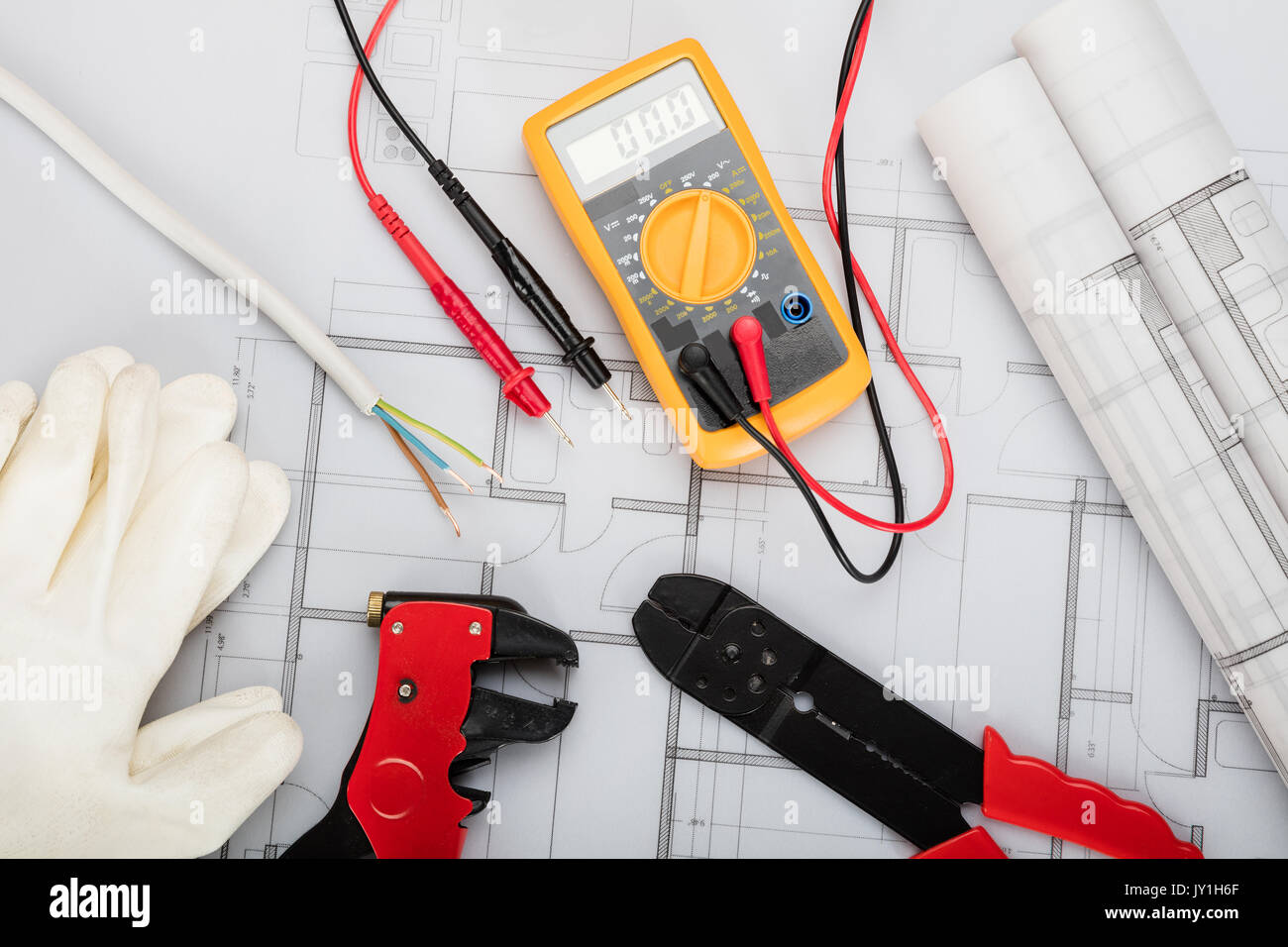 High Angle View Of Electrical Components Arranged On Plans Stock Photo