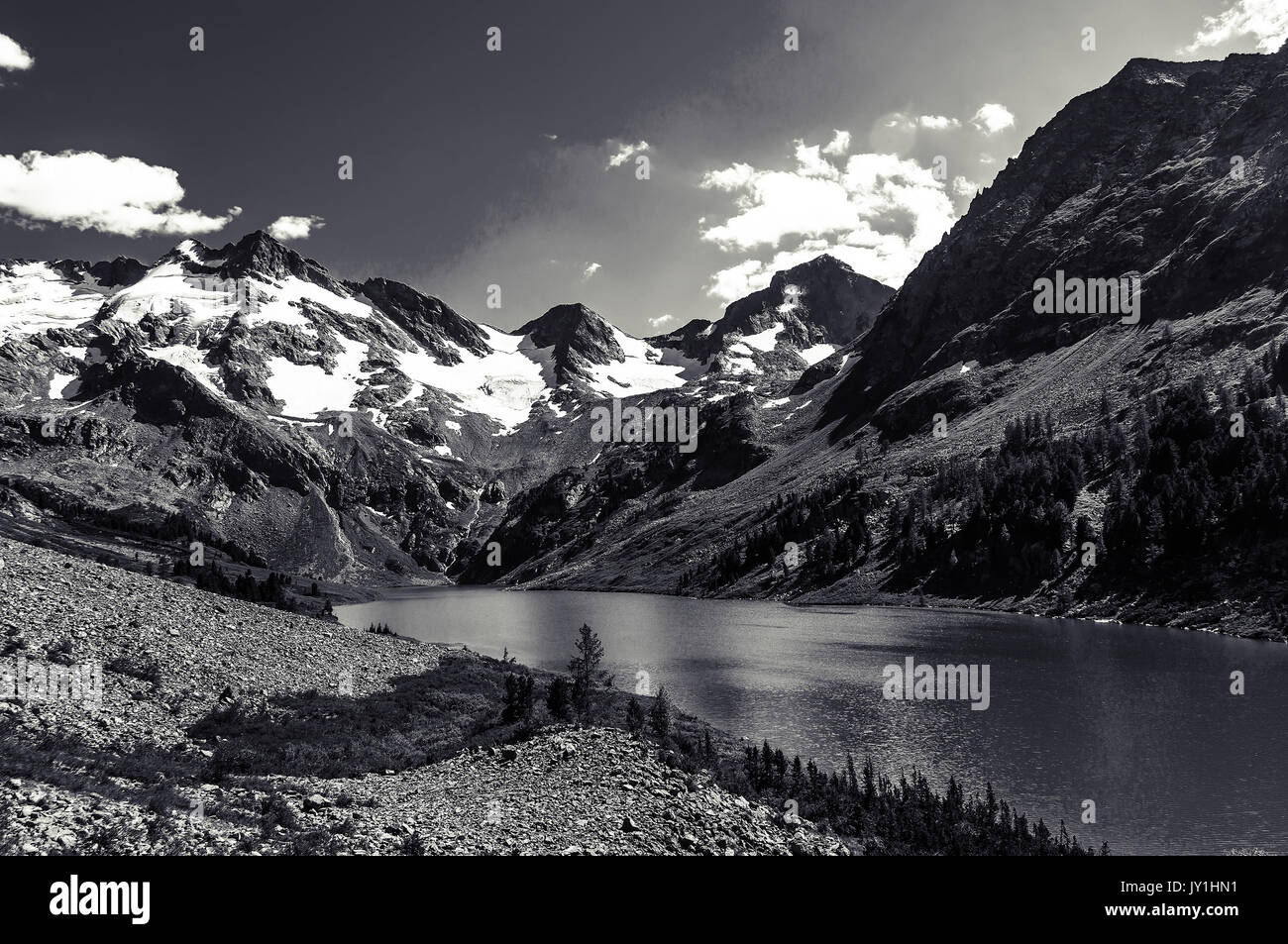 Beautiful black and white landscape and high snowy mountains and a lake