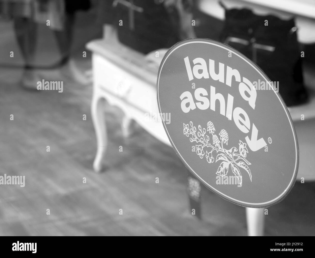 Laura Ashley sign in shop window, company founded in 1953, controlled