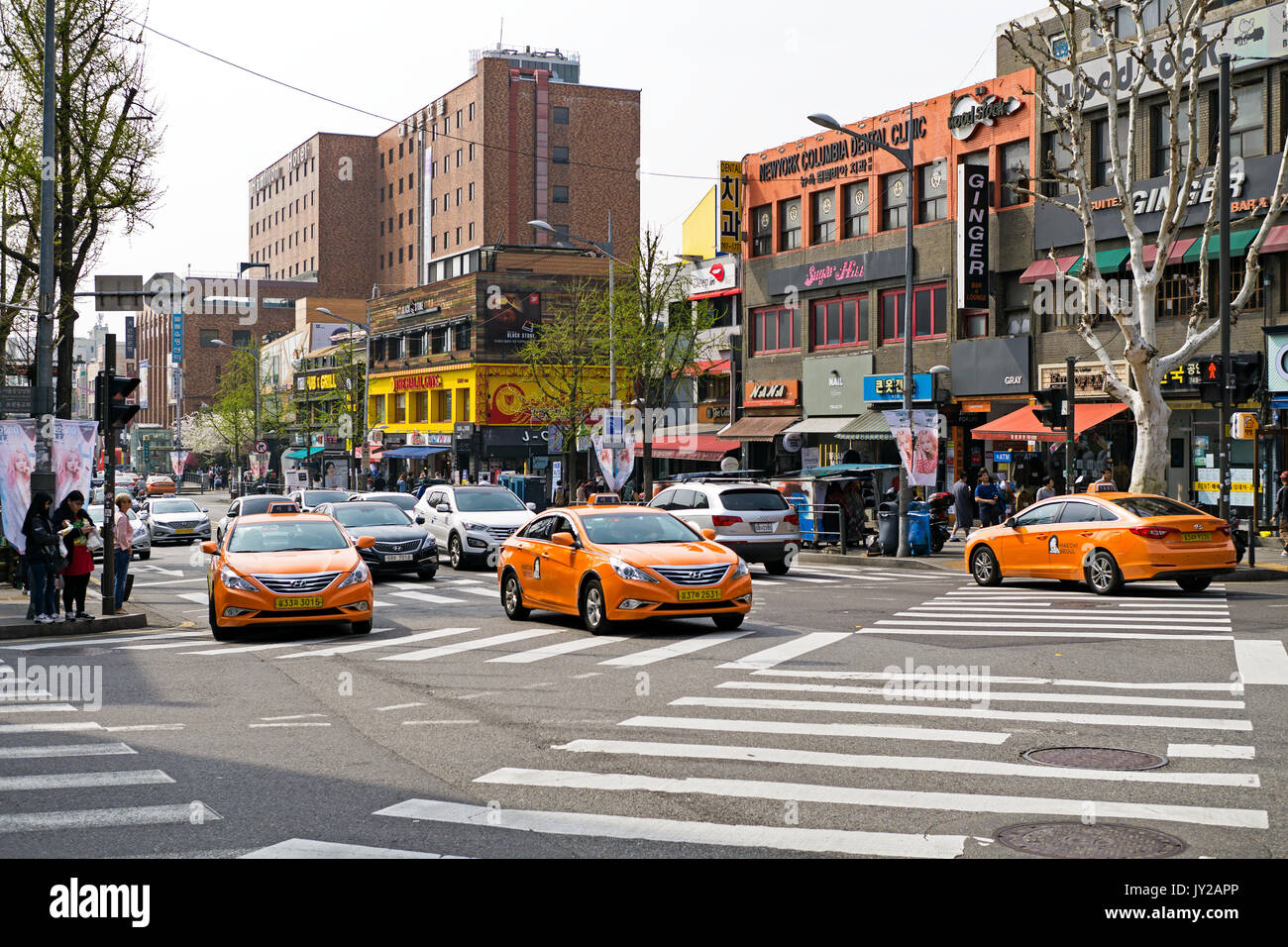 Seoul, Korea - April 08, 2017: Traffic street view with cars and tax in Itaewon town in Seoul. Itaewon is widely known as one of the most ethnically d Stock Photo