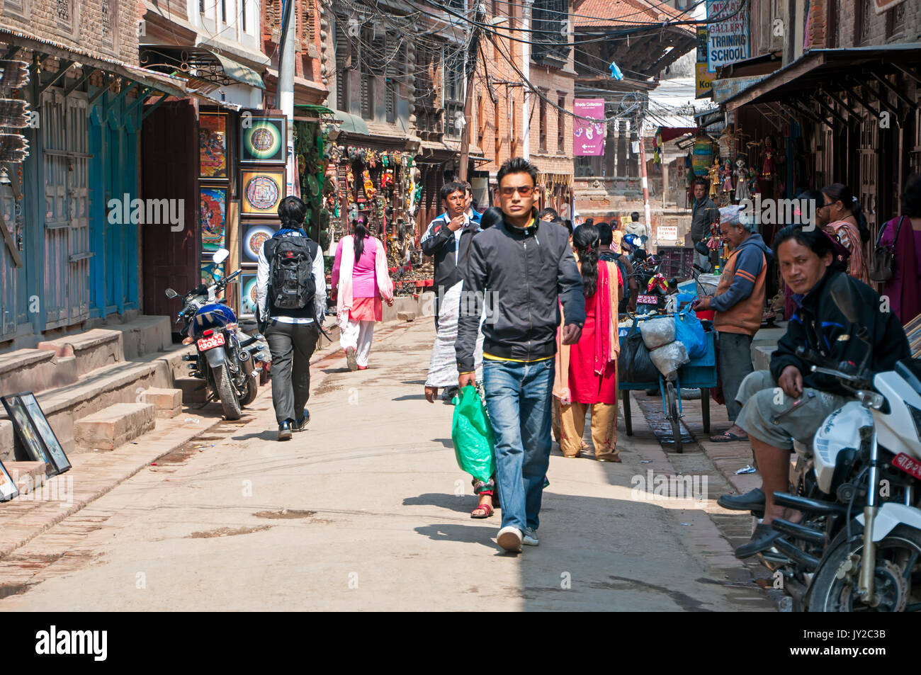 Kathmandu, Nepal - March 9, 2013: Crowd of people in the alley of Thamel street. Thamel is a commercial neighbourhood in Kathmandu, the capital of Nep Stock Photo