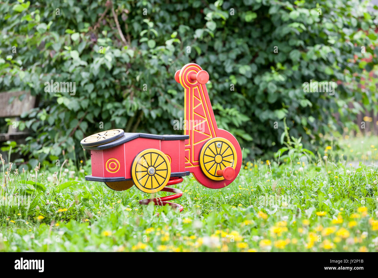 On the playground this car is a spring swing Stock Photo Alamy