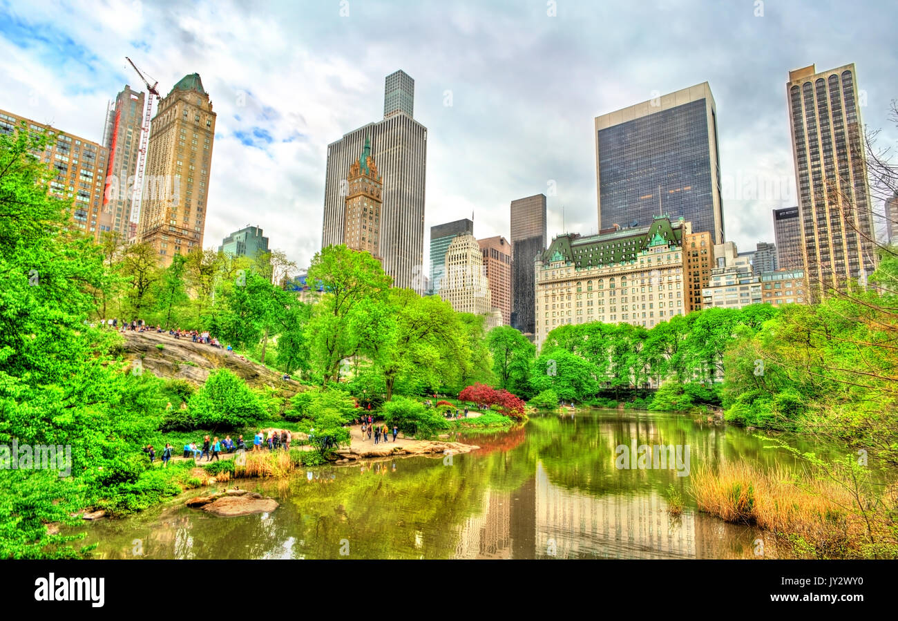 Central Park with the Pond and Manhattan Skyline - New York City Stock Photo