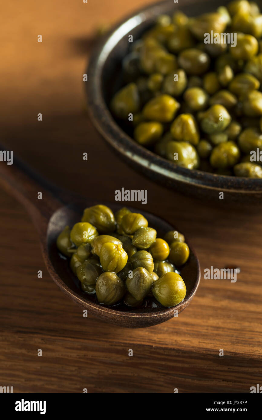 Raw Green Organic Marinated Capers in a Bowl Stock Photo Alamy