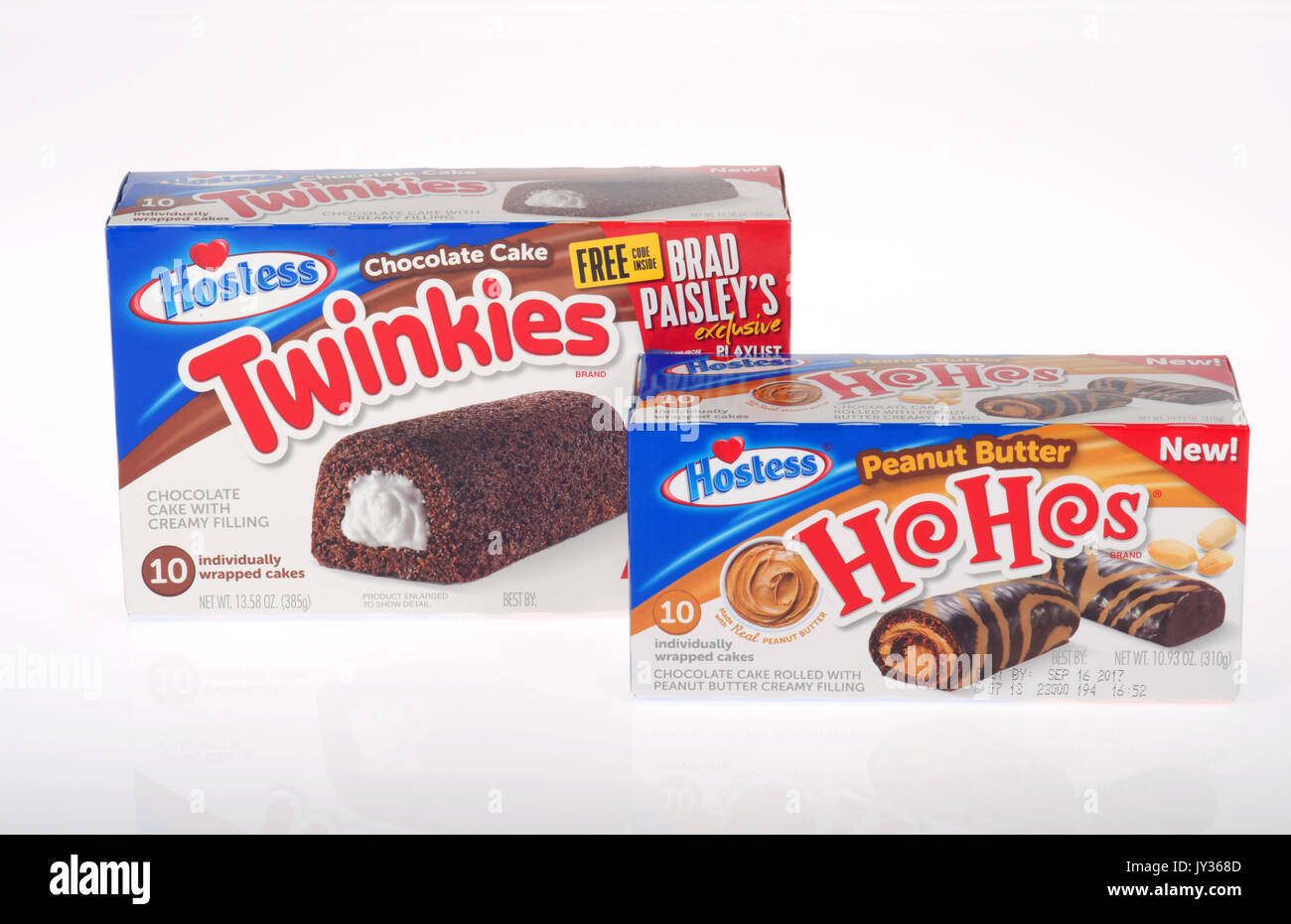 Unopened boxes of Hostess Chocolate Twinkies and peanut butter filled HoHos on white background. USA Stock Photo