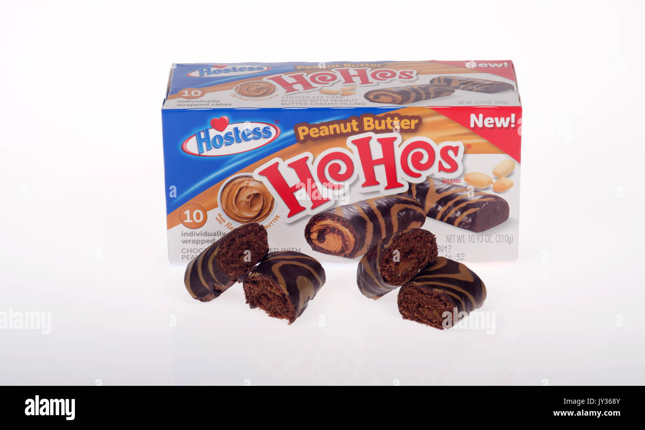 Unopened boxes of Hostess peanut butter filled chocolate covered HoHos on white background. USA Stock Photo