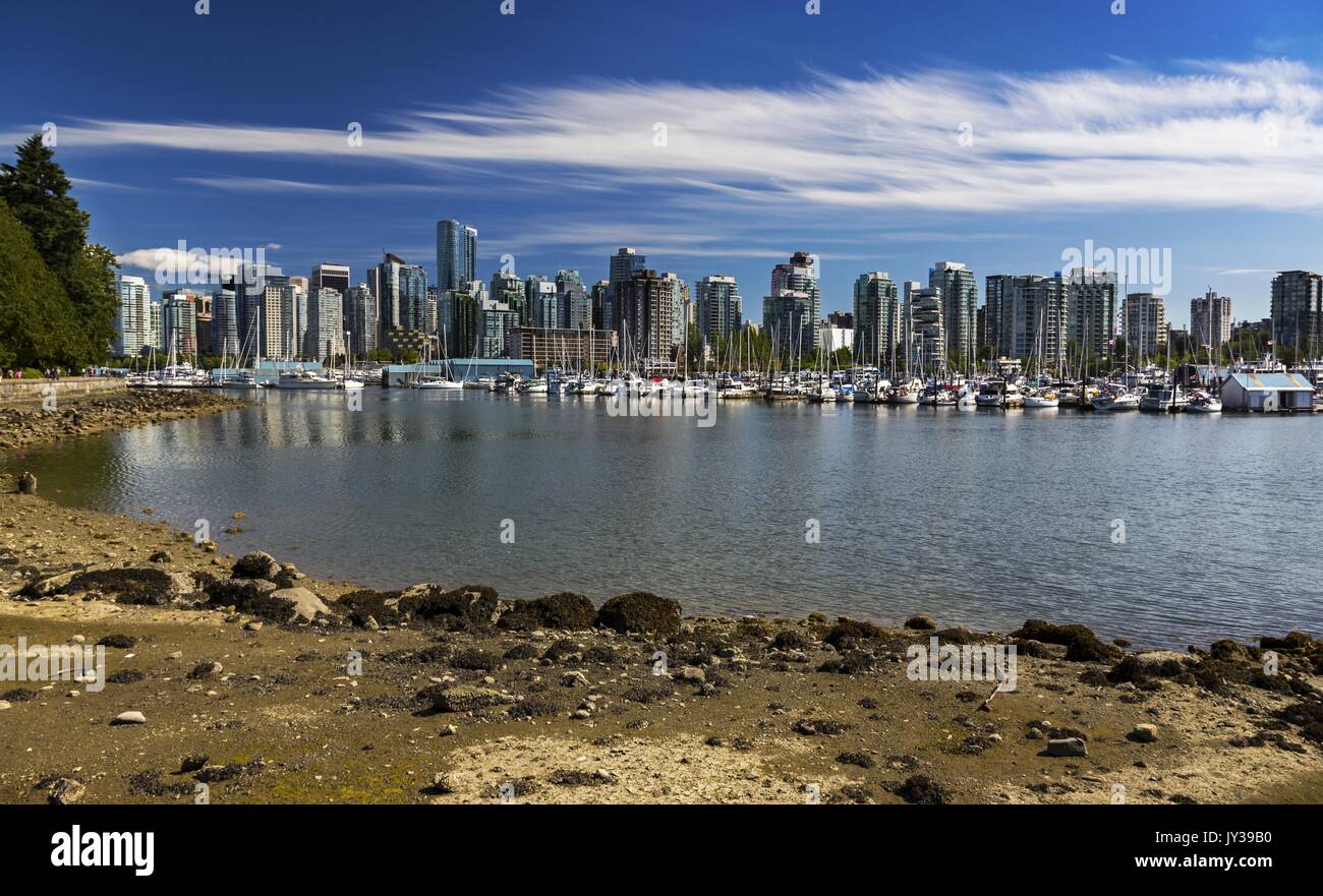 Vancouver Downtown City Center Skyline, Boats Marina Scenic Landscape View from Stanley Park Seawall Beach on a Sunny Day in British Columbia Canada Stock Photo