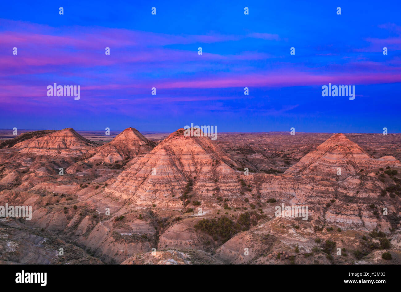 sunrise over haystack buttes in the terry badlands near terry, montana
