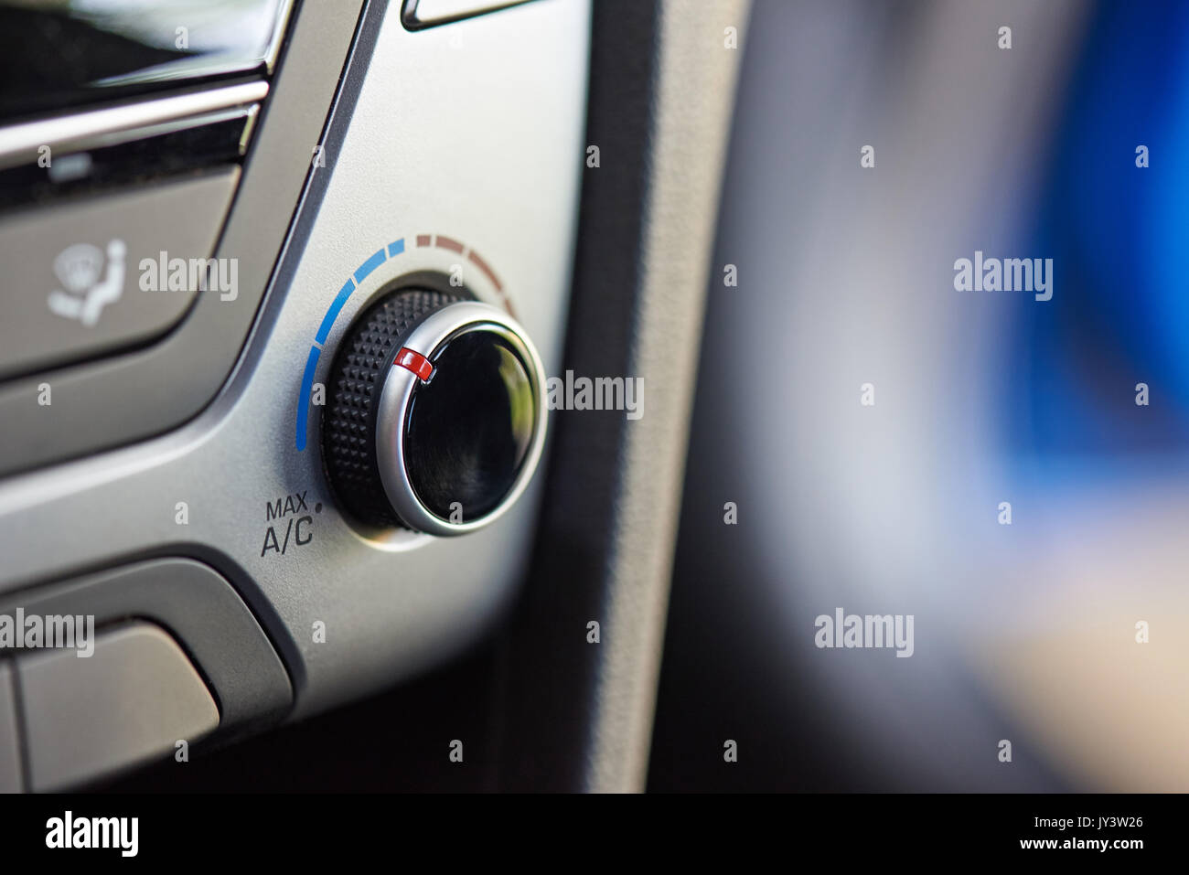 Macro of air conditioner  knob in modern car interior Stock Photo
