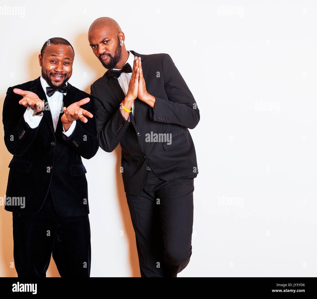 two afro-american businessmen in black suits emotional posing, g Stock ...