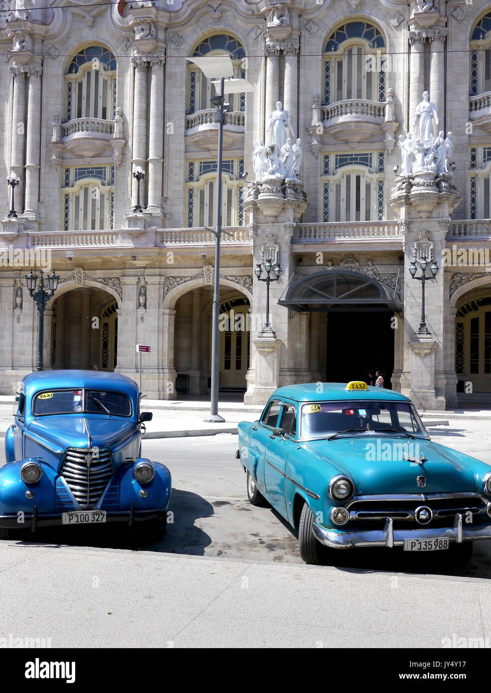 Two old cars in Havana street, Cuba Stock Photo