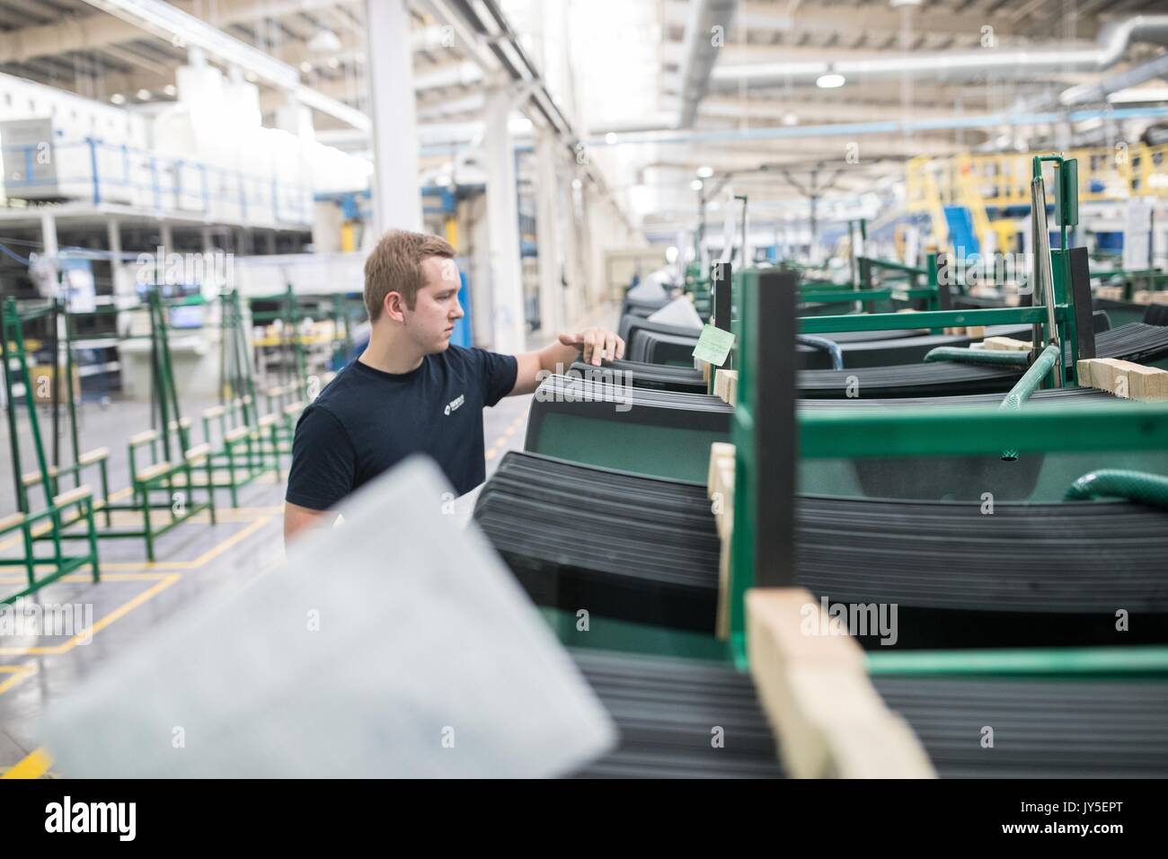 Kaluga, Russia. 18th July, 2017. A Russian worker works at an automobile-level float glass production line in the Russian factory of China's Fuyao Glass Industry Group Co. in Kaluga, Russia, July 18, 2017. Fuyao Group is a well-known Chinese enterprise that specializes in producing automobile safety glass and industrial technological glass. Fuyao invested in 2011 some 200 million U.S. dollars to build automobile-level float glass production lines in Kaluga. Credit: Wu Zhuang/Xinhua/Alamy Live News Stock Photo