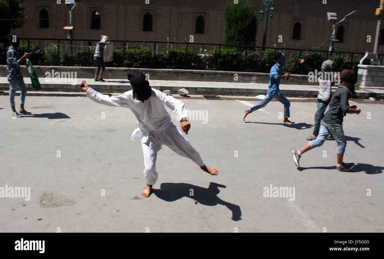 Protester throws stone in hi-res stock photography and images - Alamy