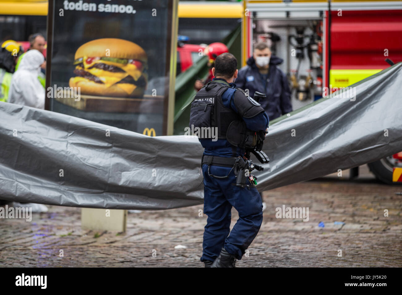 Turku, Finland. 18th of August 2017. Heavily armed police guarding at the scene of knife attack in Turku market square. Two people have been killed and six others wounded in a knife attack at Turku market square and Puutori. The police was able to stop the attacker within minutes after the first emergency call by shooting him at thigh. Credit: Jarmo Piironen/Alamy Live News Stock Photo