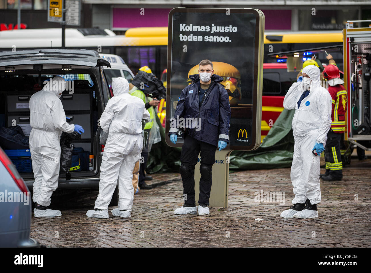 Turku, Finland. 18th of August 2017. Investigators at the scene of knife attack in Turku market square. Two people have been killed and six others wounded in a knife attack at Turku market square and Puutori. The police was able to stop the attacker within minutes after the first emergency call by shooting him at thigh. Credit: Jarmo Piironen/Alamy Live News Stock Photo
