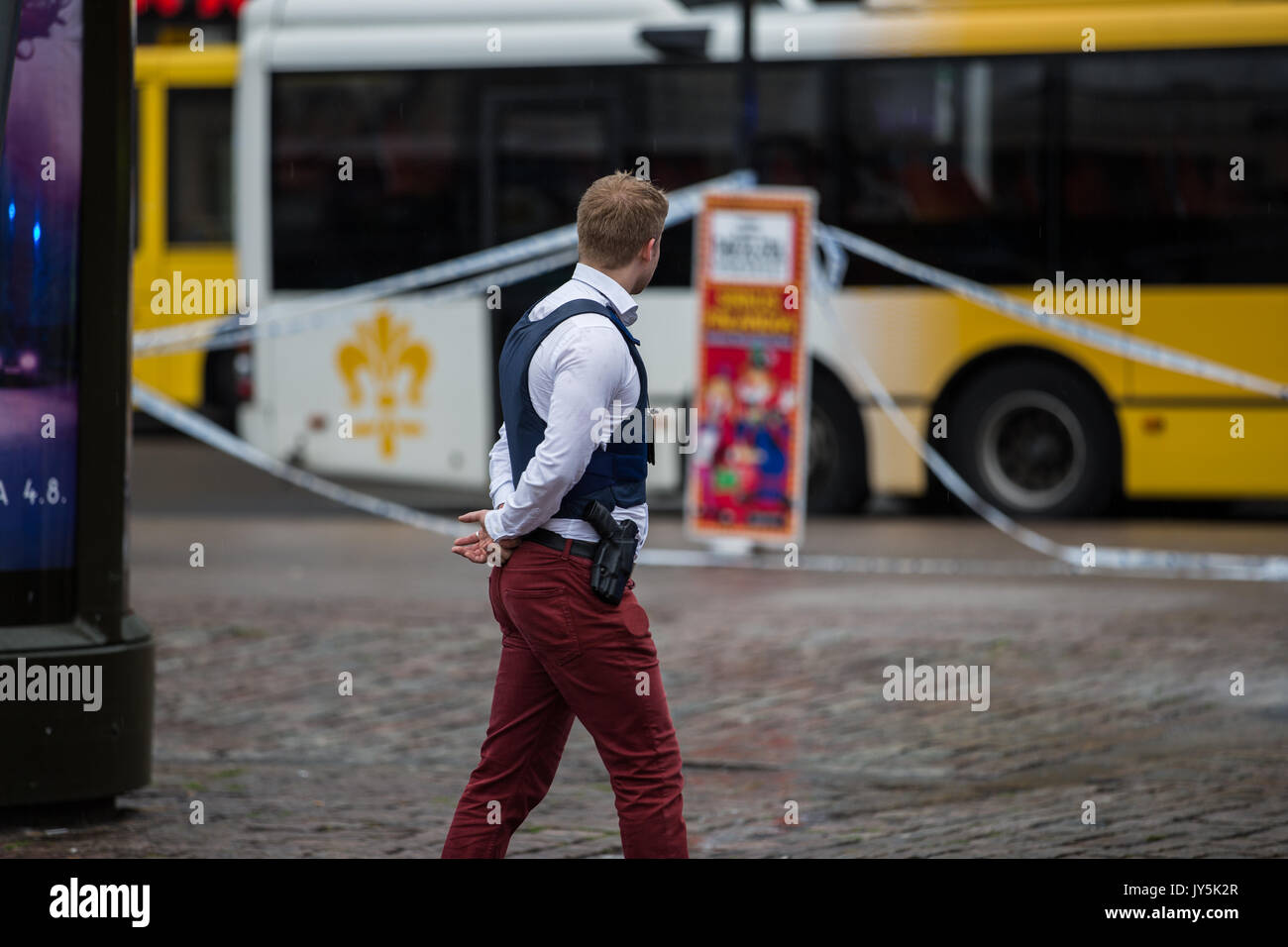 Turku, Finland. 18th of August 2017. Police guarding the area at Turku market Square. Two people have been killed and six others wounded in a knife attack at Turku market square and Puutori. The police was able to stop the attacker within minutes after the first emergency call by shooting him at thigh. Credit: Jarmo Piironen/Alamy Live News Stock Photo