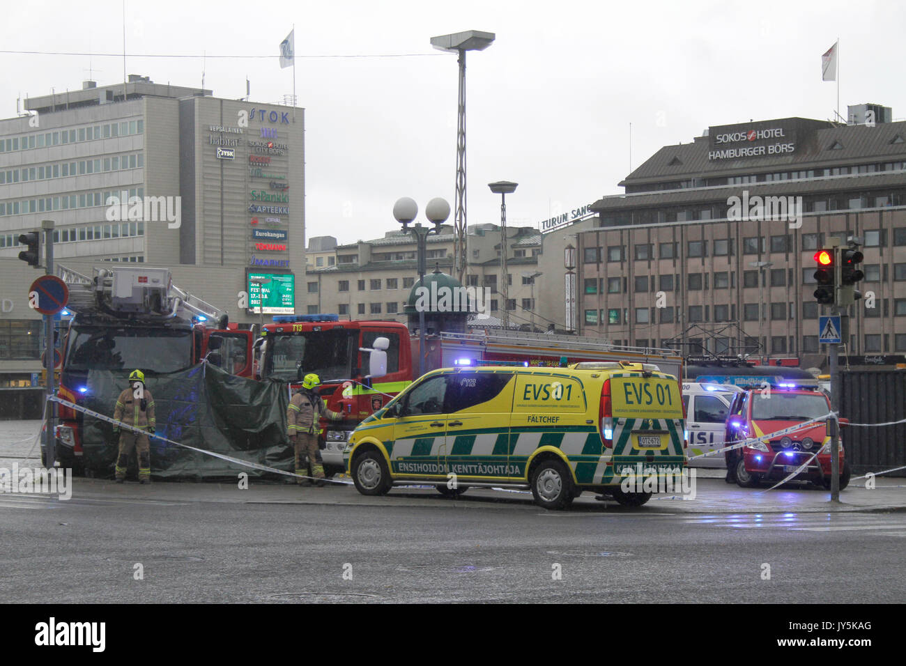 Turku, Finland. 18th August, 2017. Several people have been stabbed in Central Market Square of Turku and Puutori Market Square nearby this location. At least one person has been killed at the Central Market Square and is supposedly behind green tarp. Several other have been wounded. Police has secluded area. Credit: Jukka Palm/Alamy Live News Stock Photo