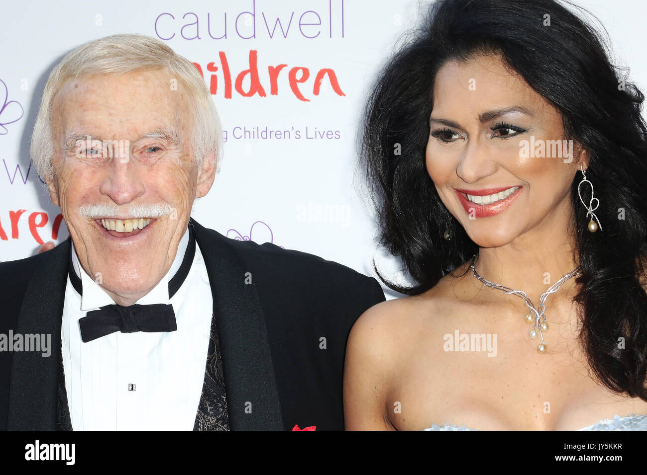 FILE PICS: Sir Bruce Forsyth, Lady Wilnelia Forsyth, Caudwell Children Butterfly Ball, Grosvenor House Hotel, London UK, 25 June 2015, Photo by Richard Goldschmidt Credit: Rich Gold/Alamy Live News Stock Photo