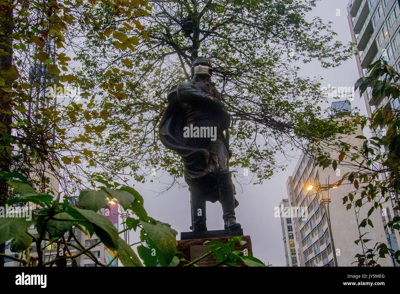 August 18, 2017 - SÃ¢O Paulo, SÃ£o Paulo, Brazil - SAO PAULO, BRAZIL - AUGUST 18: Sculpture of Francisco de Miranda, in Praça do Ciclista, in the region of Avenida Paulista, in SÃ£o Paulo (SP) dawned masquerade in protest against the PL (Law Bill) 300/2017, which extends to 20 years the term for the use of Renewable fuel in 100% of the capital's buses. According to a study made at Greenpeace's request, more than 3,000 deaths will be caused this year in the capital due to health problems aggravated by the emission of pollutants from the diesel bus fleet. For Pedro Telles, a climate change expe Stock Photo