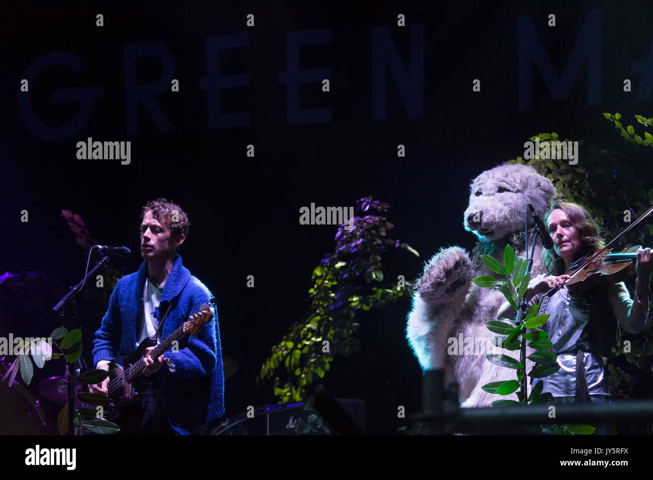 Neil Hamilton Wilkinson and Abi Fry of BRITISH SEA POWER play on the Mountain Stage with their usual flair for unusual stage invasions. Day One of the Green Man music festival in Glanusk Park, Brecon Beacons Mountains, Wales, UK on 18 August 2017. Photo: Rob Watkins.   INFO: British Sea Power, an English indie rock band, captivate audiences with their eclectic sound and energetic live performances. Albums like 'The Decline of British Sea Power' and 'Do You Like Rock Music?' showcase their melodic hooks and imaginative lyrics. On 9 August 2021 the band changed their name to SEA POWER. Stock Photo