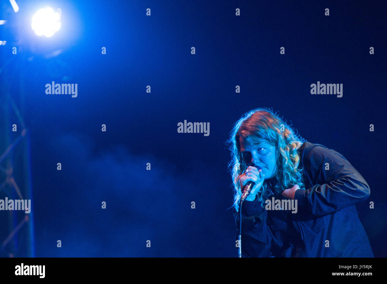 KATE TEMPEST, YOUNG, CONCERT, 2017: The artist now known as Kae Tempest plays on the Far Out Stage on Day One of the Green Man music festival in Glanusk Park, Brecon, Wales, UK on 18th August 2017. Credit: Rob Watkins/Alamy Live News.  INFO: Kae Tempest, a British spoken word artist and rapper, captivates audiences with their powerful storytelling and lyrical prowess. Their albums like 'Everybody Down' and 'The Book of Traps and Lessons' showcase their ability to blend poetry, hip-hop, and social commentary, earning critical acclaim and a devoted following. Stock Photo