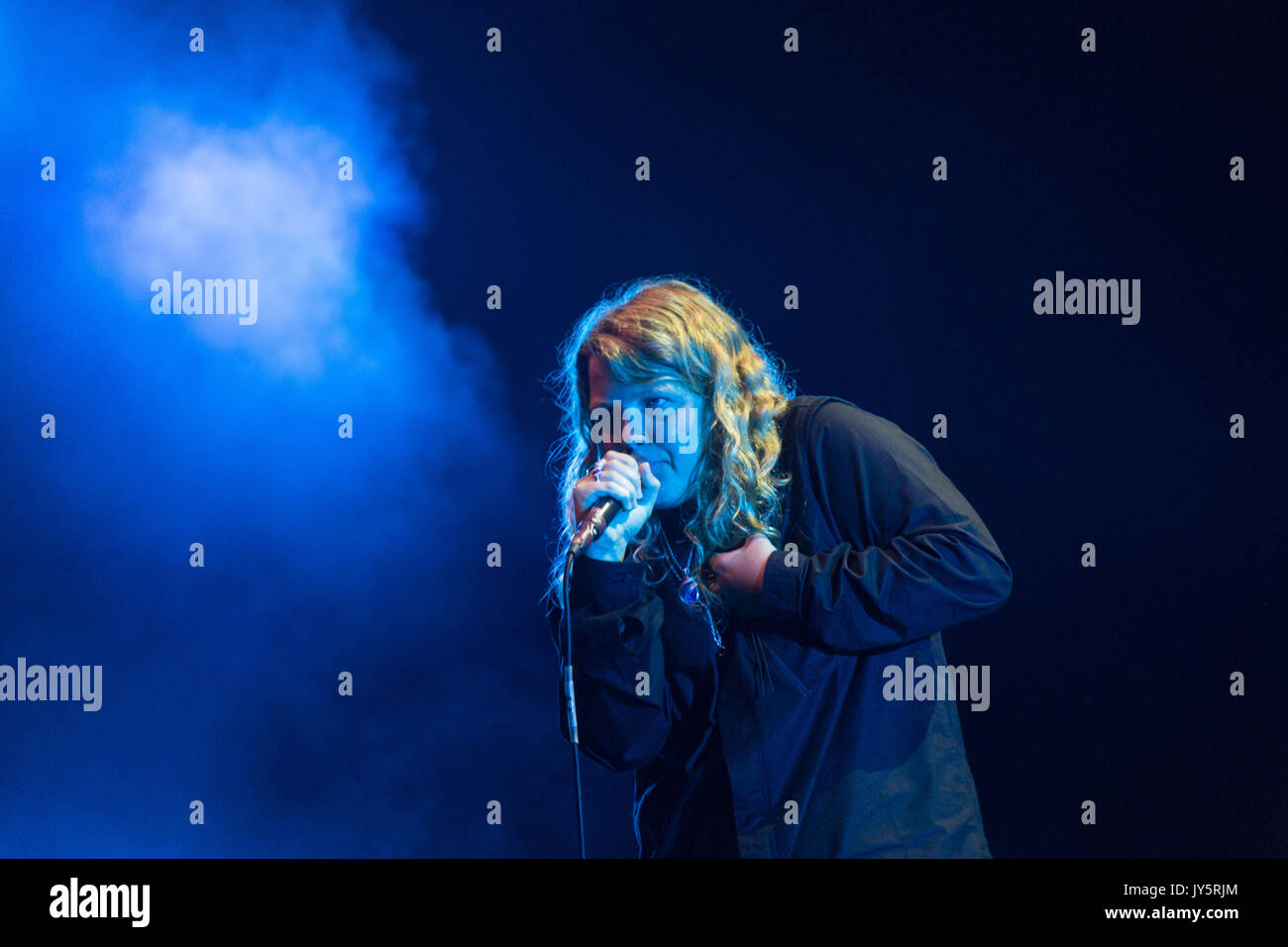 KATE TEMPEST, YOUNG, CONCERT, 2017: The artist now known as Kae Tempest plays on the Far Out Stage on Day One of the Green Man music festival in Glanusk Park, Brecon, Wales, UK on 18th August 2017. Credit: Rob Watkins/Alamy Live News.  INFO: Kae Tempest, a British spoken word artist and rapper, captivates audiences with their powerful storytelling and lyrical prowess. Their albums like 'Everybody Down' and 'The Book of Traps and Lessons' showcase their ability to blend poetry, hip-hop, and social commentary, earning critical acclaim and a devoted following. Stock Photo