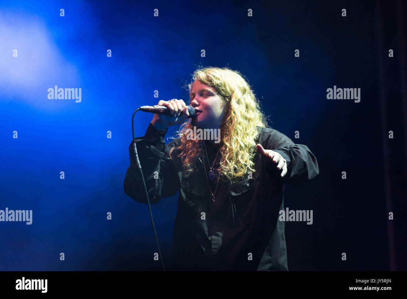 KATE TEMPEST, YOUNG, CONCERT, 2017: The artist now known as Kae Tempest plays on the Far Out Stage on Day One of the Green Man music festival in Glanusk Park, Brecon, Wales, UK on 18th August 2017. Credit: Rob Watkins/Alamy Live News.  INFO: Kae Tempest, a British spoken word artist and rapper, captivates audiences with their powerful storytelling and lyrical prowess. Their albums like 'Everybody Down' and 'The Book of Traps and Lessons' showcase their ability to blend poetry, hip-hop, and social commentary, earning critical acclaim and a devoted following. Stock Photo