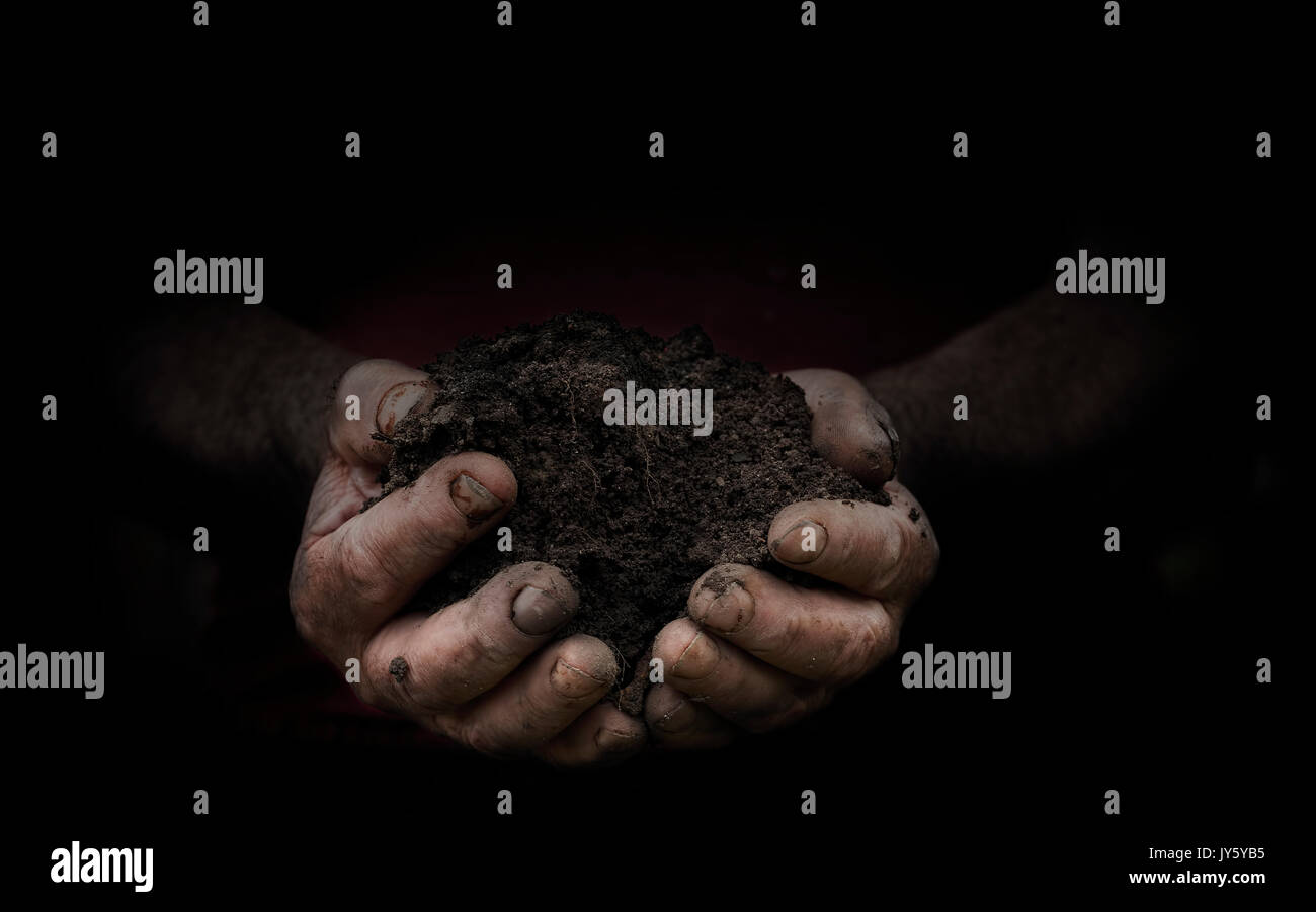 Hand Ful Handful of mud hi-res stock photography and images - Alamy