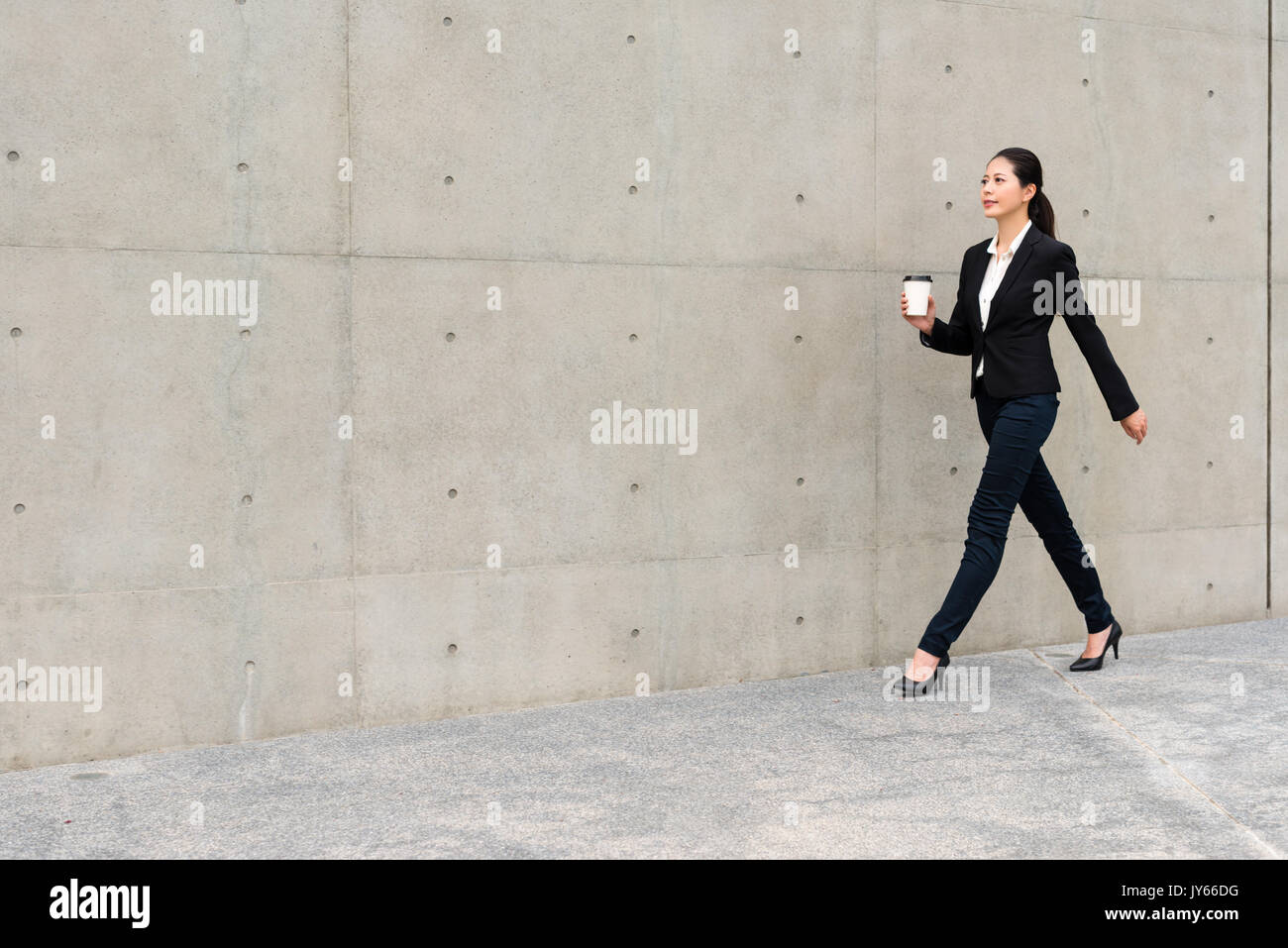 beautiful suit right woman holding white coffee paper cup walking in ...