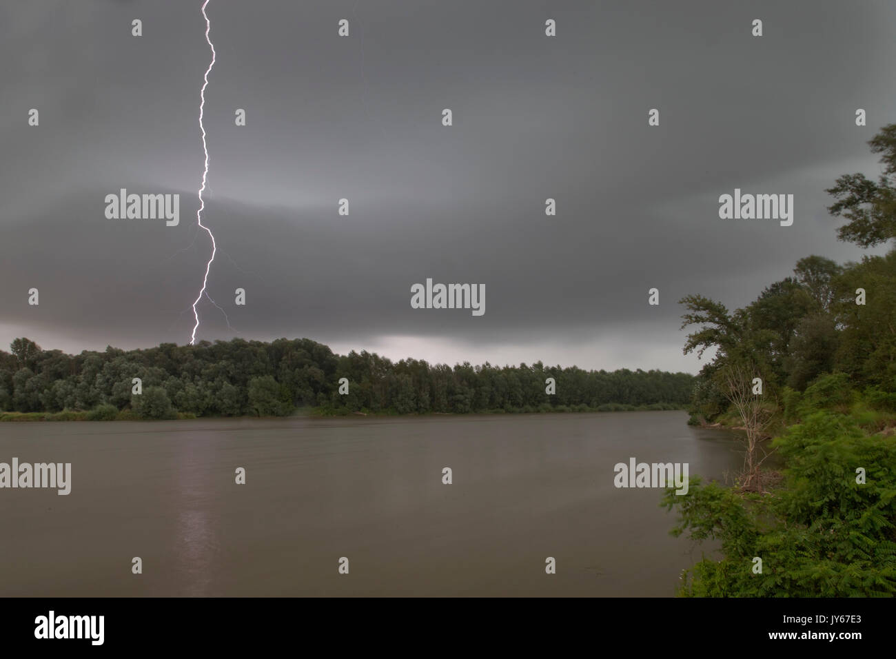Storm with lightnings at the Drava River Stock Photo