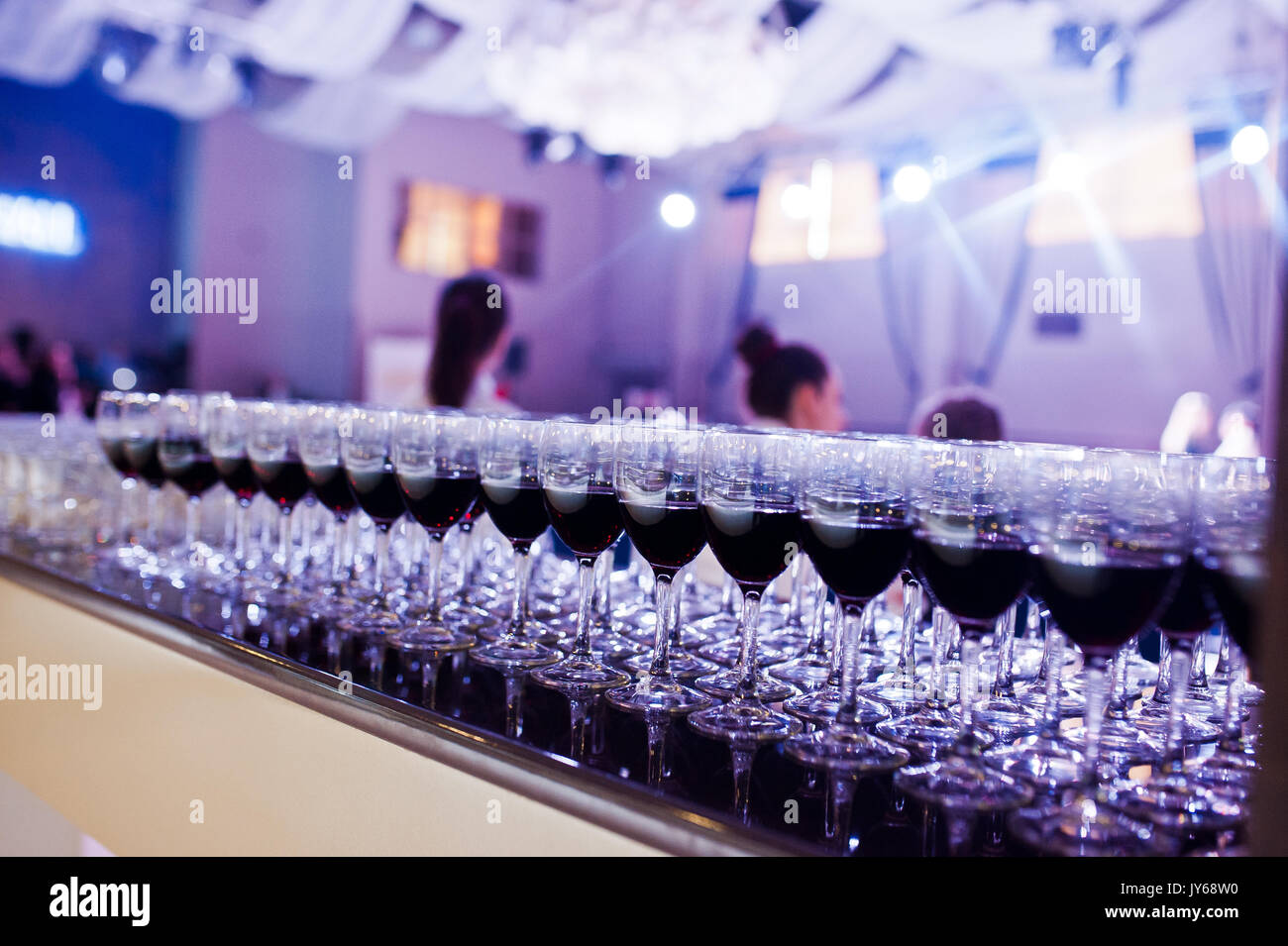Close up Photo Of A Huge Quantity Of Glasses Filled With Red Wine Stock close-up-photo-of-a-huge-quantity-of-glasses-filled-with-red-wine-stock